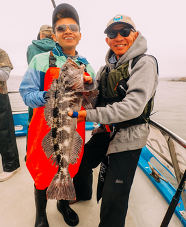 CCFRP photo with volunteer angler and Eduardo showing a lingcod fish. 