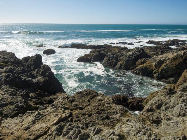 Rocky coastline with waves breaking on the rocks